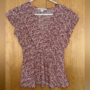 Red and white floral blouse